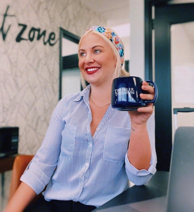 Mykela Lesso drinking coffee in the Nashville office
