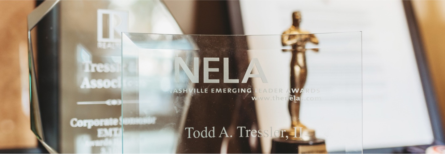 Nashville Emerging Leader Award Todd A. Tressler, II and other awards on a table