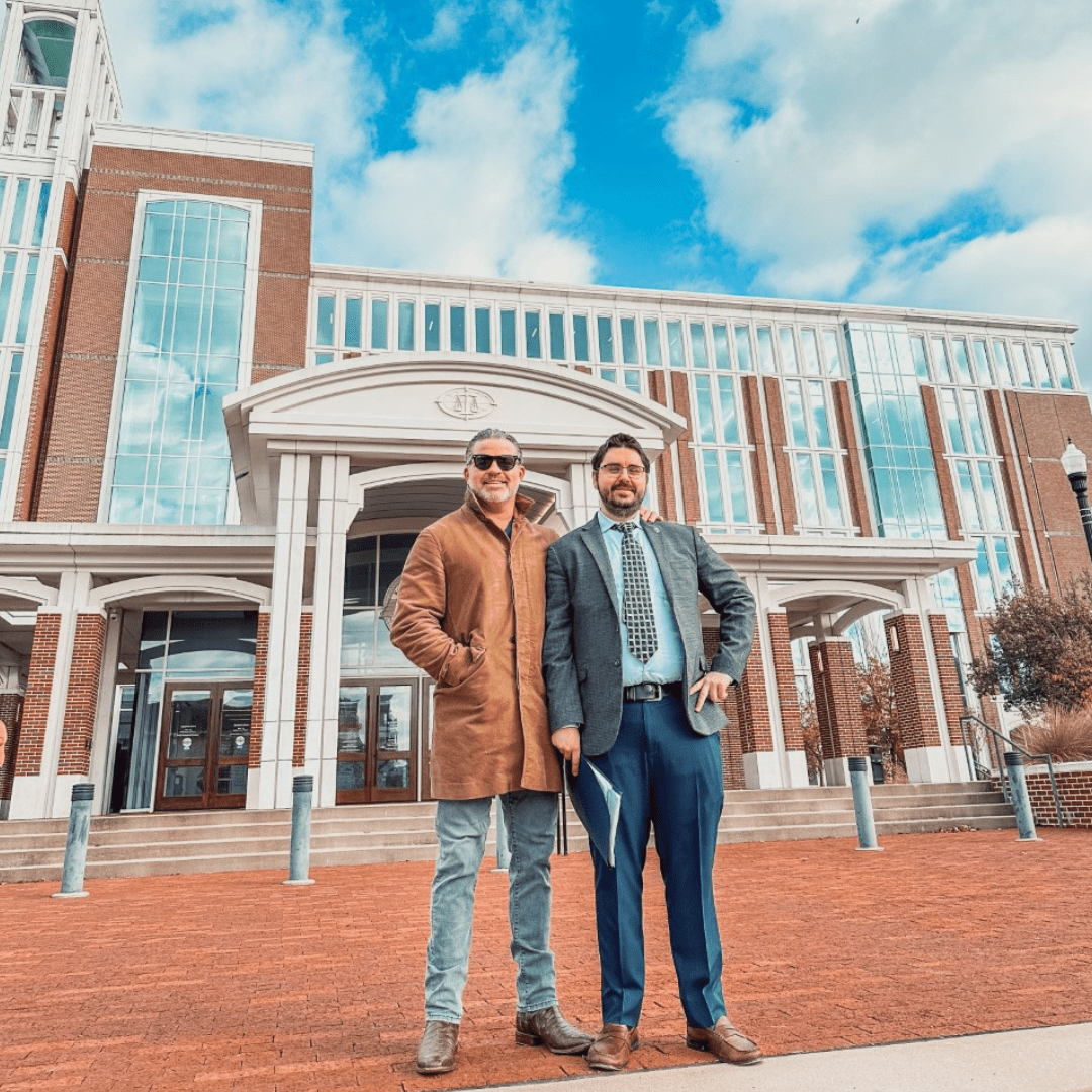 Turner Smith Evan and Todd Tressler standing together on a bright sunny day