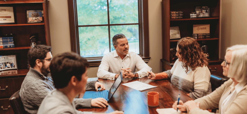 Tressler team meeting in the small conference room at the Lebanon office location