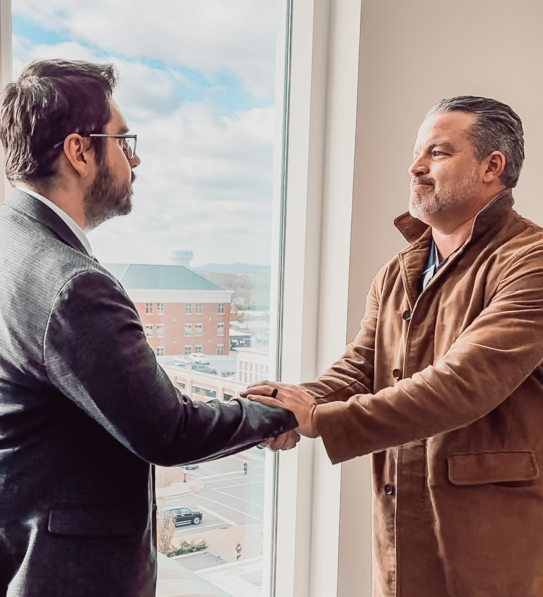 Turner Smith Evans and Todd Tressler shaking hands