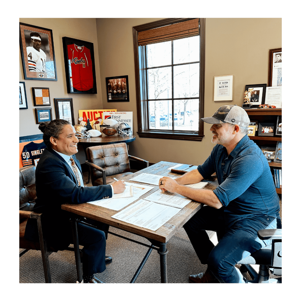 Todd & George working together on some paperwork.